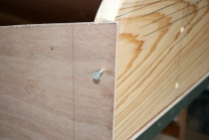 10. Tack upper corners of transom with deck screws until nailing.