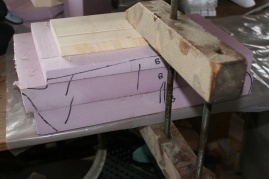 16. Clamp with a board on top.