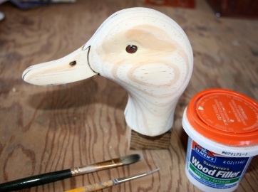 62. Shape around the eye with wet brushes and fair the filler into the adjoining wood.