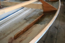 Shelf fiddles are screwed right through hull - to "clamp" them until epoxy cures.