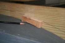 The fore and aft coamings are scribed to the deck radii.