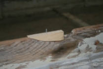 16 - The Cypress dutchman was set in epoxy and a galvanized nail was set well below flush to reinforce the repair.